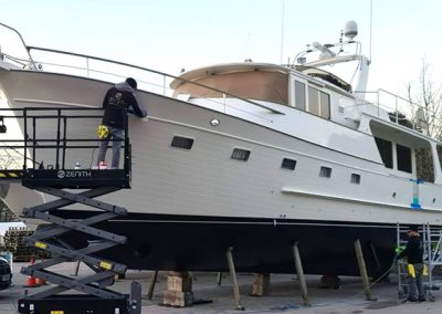 Yacht being worked on by engineer