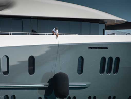 Guy pulling up a Yacht fender