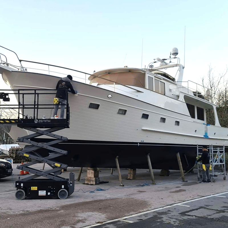 A yacht having work done in yacht surrounded by scaffolding